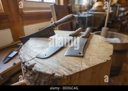 Old cutting tools on a wooden table in an authentic working environment, local history museum, Gechingen, Hecken and Gaeu region, Calw district, Germa Stock Photo