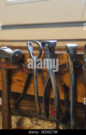 Various hand tools hang on a wooden panel, local history museum, Gechingen, Hecken and Gaeu region, Calw district, Germany Stock Photo