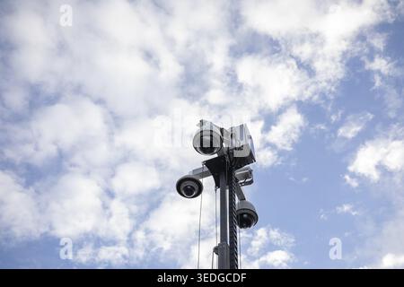 03.05.2026: Multiple surveillance dome cameras mounted on a high metal pole against a blue cloudy sky. Kirchheim unter Teck, Baden-Wuerttemberg, Germa Stock Photo