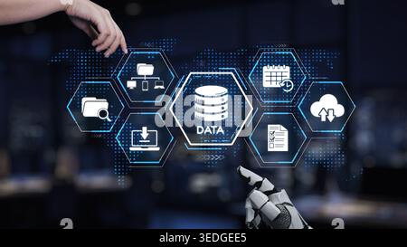 A robotic hand interacts with a digital interface displaying technology icons, representing modern data management and innovative business solutions Stock Photo