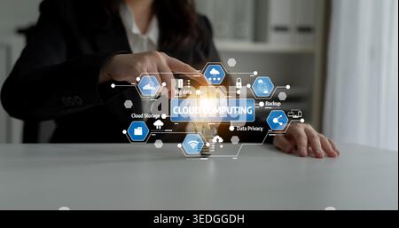 A business professional interacts with a digital cloud computing interface, illustrating modern technology impact on data security, innovation, and Stock Photo