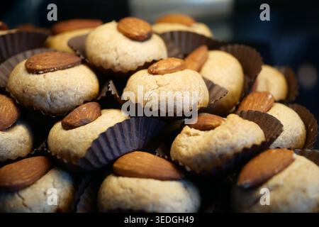 Baking cookies with almonds in a kitchen setting Stock Photo