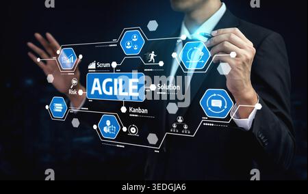 A professional businessman interacts with a digital interface showcasing agile methodology concepts like Scrum and Kanban for effective project Stock Photo