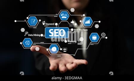 A hand presents a collection of digital icons related to SEO strategies, data mining, and best practices, symbolizing innovation in online marketing Stock Photo