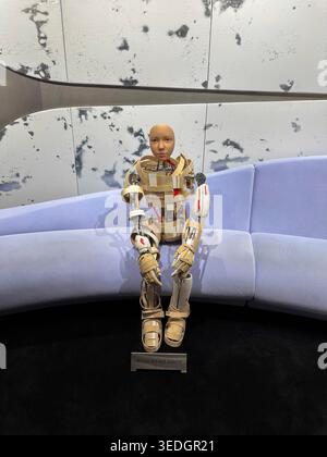 Seoul, South Korea - 05/01/2026: Humanoid robot sculpture sitting on sofa. Artificial intelligence and futuristic technology concept. Stock Photo