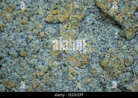 Gray granite surface shows rough, textured patterns Stock Photo