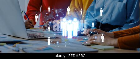 A dynamic scene in a modern office showcasing teamwork and collaboration with virtual interaction icons. Ideal for concepts of innovation and business Stock Photo