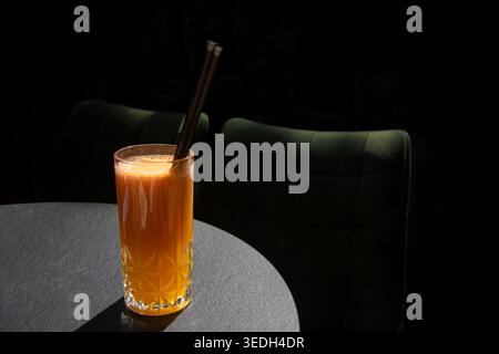 Freshly squeezed orange juice in a tall crystal glass Stock Photo