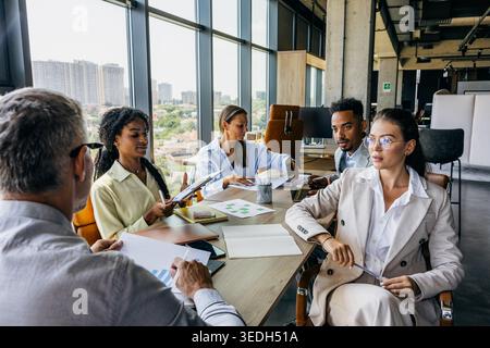 Creative Directors And Team Members Engaging In Dynamic Session Of Idea Generation And Planning Stock Photo