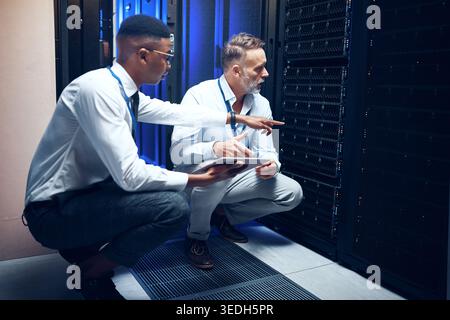 People, tablet or team in server room for problem solving, maintenance or security upgrade in business. IT support, advice or tech in datacenter with Stock Photo