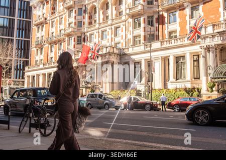 LONDON - MARCH 18, 2026: KNIGHTSBRIDGE - Woman walking outside Mandarin Oriental Hotel Brompton Road Stock Photo