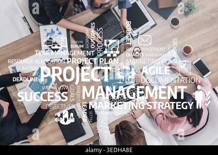 A dynamic business meeting showcasing a team engaged in project management discussions, focusing on strategy, workflow, and achieving project success Stock Photo