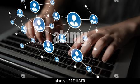 Dynamic image showing hands typing on a laptop with network connections and user icons, representing digital communication and social interaction in a Stock Photo