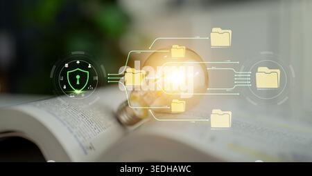 Concept of digital transformation, data security, and light bulb innovation on an open book with graphic elements representing protection and Stock Photo