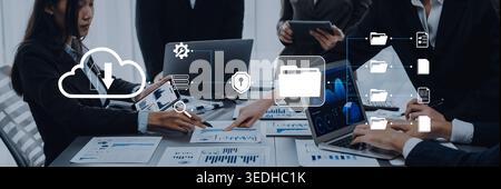 Business Meeting with Digital Data Management Concepts, Team Collaborating on Analytics and Cloud Technology in Modern Office Setting Quark. Stock Photo