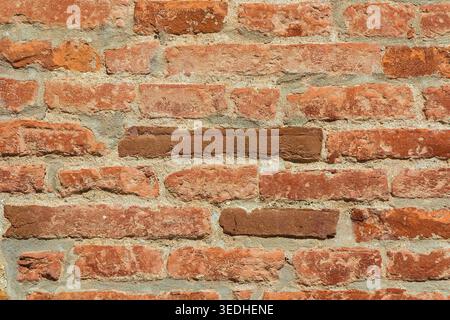 Orange, red and brown brick wall as background Stock Photo