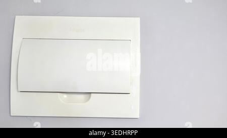 White Closed Electrical Panel in Apartment Interior Stock Photo