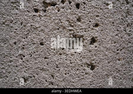 Volcanic basalt stone texture with porous holes in Clermont-Ferrand, France surface Stock Photo