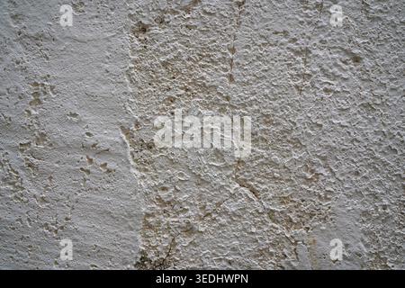 White grunge wall texture with cracks and rough plaster in Clermont-Ferrand, France Stock Photo