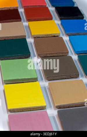 Colorful tile samples arranged in a grid for material selection, showing texture and color Stock Photo