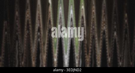 A textured, abstract background consisting of a repeating, sharp zigzag pattern in shades of brown, black, and hints of green. Stock Photo
