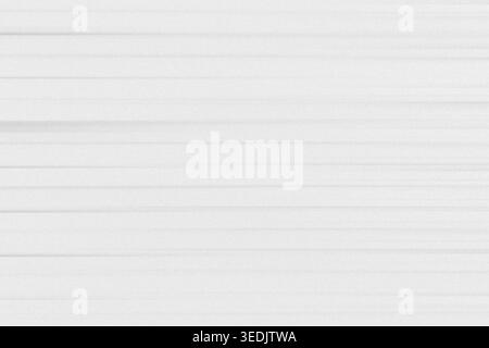 A clean abstract background composed of thin, parallel horizontal lines on a white surface with a light grainy texture, perfect for minimalist designs Stock Photo