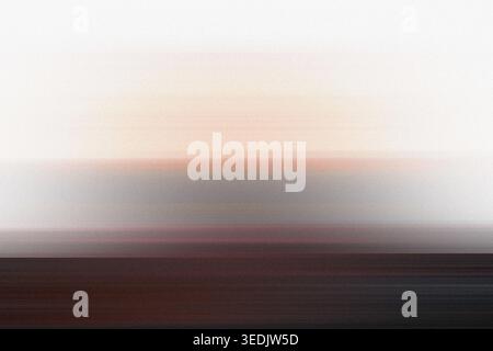 An abstract landscape composition capturing the essence of a sunset through horizontal motion blur, blending warm orange hues with deep dark shadows. Stock Photo
