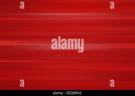 A vibrant red background featuring horizontal motion blur lines and a subtle grainy texture, creating a dynamic and modern aesthetic. Stock Photo