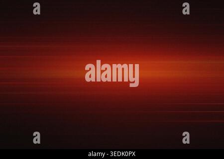 A dark red abstract background featuring a bright horizontal light band across the center, accented by subtle motion blur streaks and a fine film grai Stock Photo