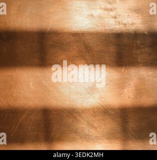 Copper background with shadow stripes. Abstract backgrounds for design. Minimal. Stock Photo