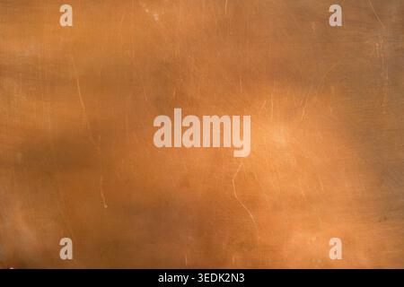 Warm сopper surface with different lighting. Minimal background. Industrial backdrop for design. Copy space. Stock Photo