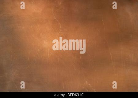 Warm сopper surface with different lighting. Minimal background. Industrial backdrop for design. Copy space. Stock Photo