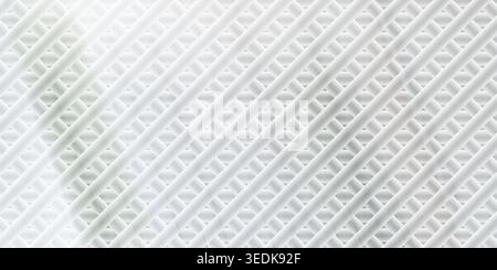 A bright, abstract background featuring a diagonal metallic wire mesh pattern with a soft white glow and light grey tones. Stock Photo