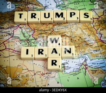 Scrabble tiles spelling Trump, Iran and war on a Middle East map, illustrating US foreign policy and conflict risk. Stock Photo