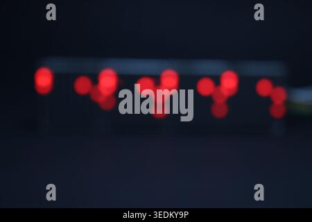 LED matrix display showing pattern of lights in blurred background. Concept of data transferring with led light Stock Photo