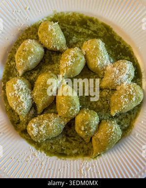 Gourmet Italian entrée of fresh gnocchi with pesto sauce., 2026, New York City, USA Stock Photo