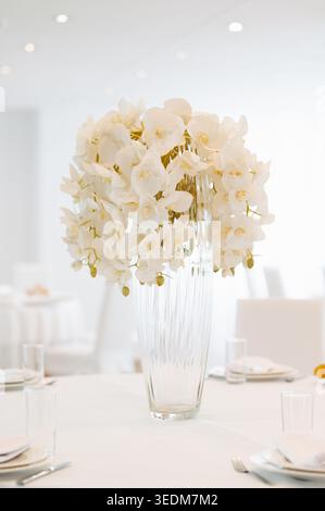 Elegant Modern Interior Adorned With Bright Hydrangea Bouquets And Upscale Table Arrangements Stock Photo