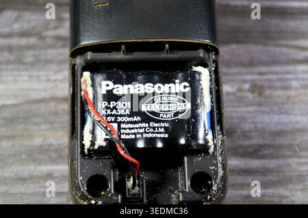 Cairo, Egypt, April 4 2026: a Panasonic Genuine Telephone Part battery, used in older cordless phone handsets, with significant corrosion surrounding Stock Photo