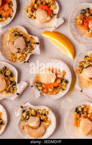 Cooked scallops with sauce on a baking sheet Stock Photo