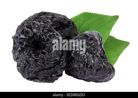 Prunes isolated on white background, heap of dried plums. Stock Photo