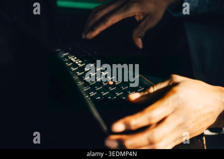 Close-up of businessman working on laptop at modern startup office Stock Photo