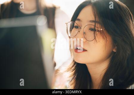Close-up of female computer programmer working at office Stock Photo