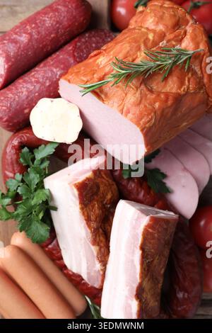 Different types of sausages, cured meat and spices on table, top view Stock Photo