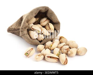 Pistachio nuts in sack isolated on white Stock Photo