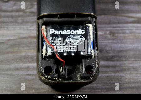 Cairo, Egypt, April 4 2026: a Panasonic Genuine Telephone Part battery, used in older cordless phone handsets, with significant corrosion surrounding Stock Photo