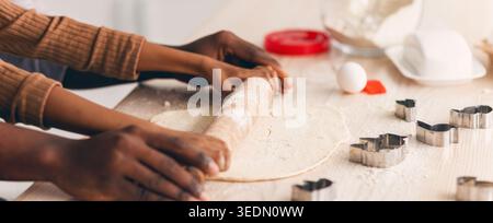 Children and Adult Preparing Dough for Baking Cookies in Kitchen Stock Photo