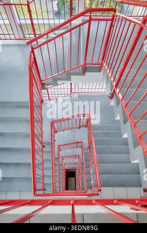 Looking down the stairwell of a tall building. Stock Photo
