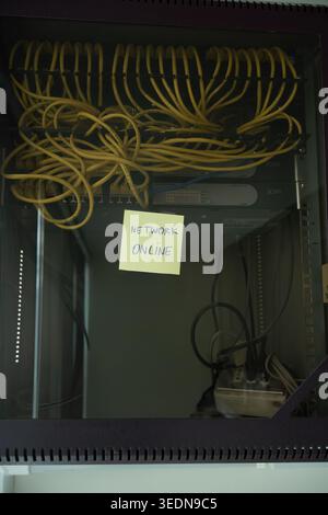 Network Online Confirmation Note on Professional Server Rack Stock Photo