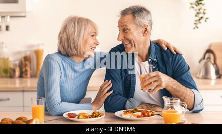 Couple Enjoys Breakfast Together in a Cozy Kitchen Setting Stock Photo