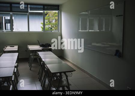 Minimalist school interior with light walls and academic furniture Stock Photo